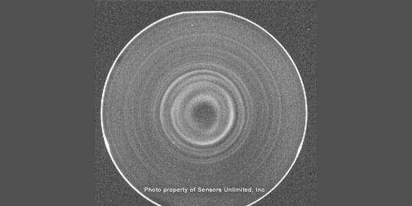 PL image of wafer sliced from silicon boule, acquired with ~60 W driving the lasers and 16 ms exposure time for Goodrich camera. Outer ring is strong specular reflection of laser light from rounded edge of wafer slice penetrating single RG-1000 LP filter.