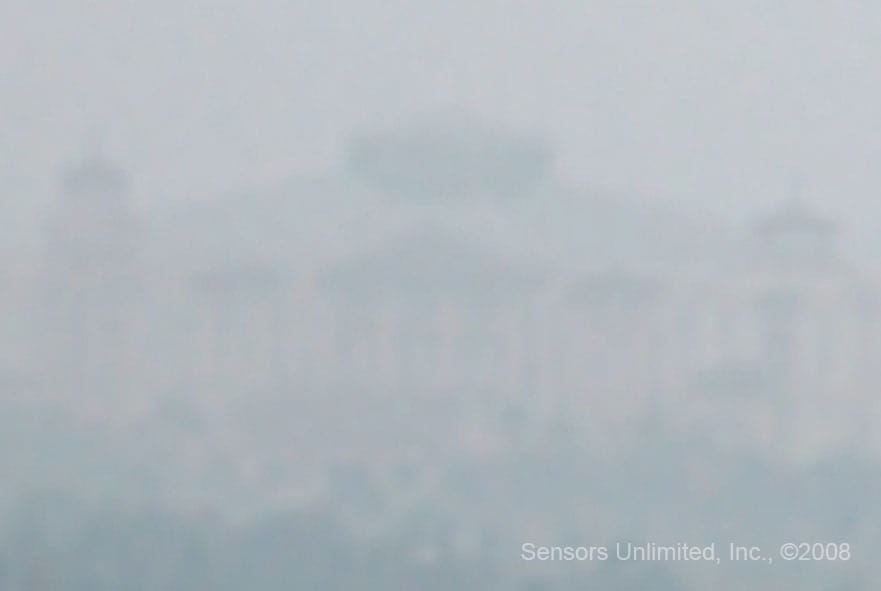 A building obscured by rain