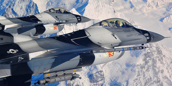 Close-up of two F16 fighters flying in formation