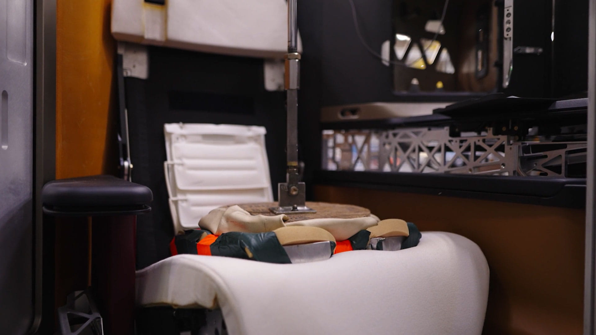 An aircraft seat cushion being manufactured