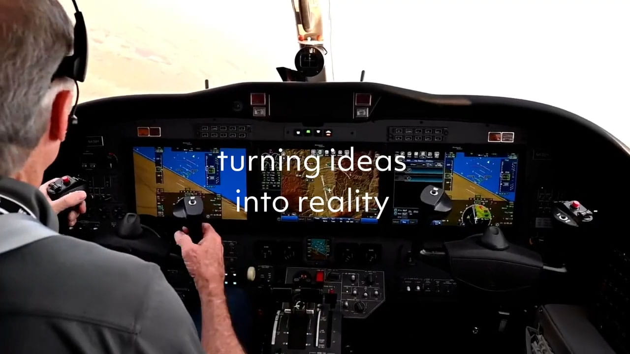 A pilot on the flight deck. The text 'turning ideas into reality' is shown.
