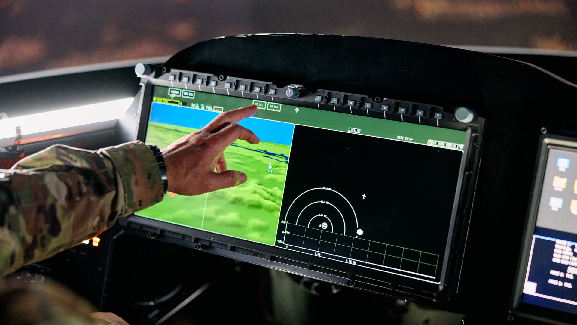 A hand touching an interactive display