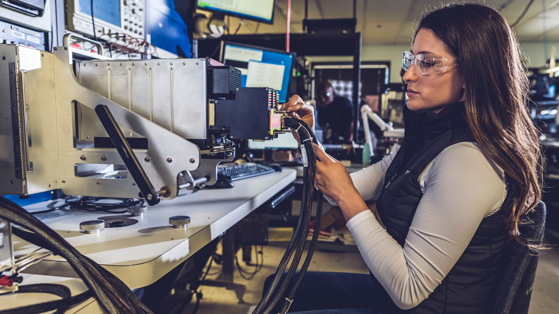A female Collins employee working in the Wichita Service Center