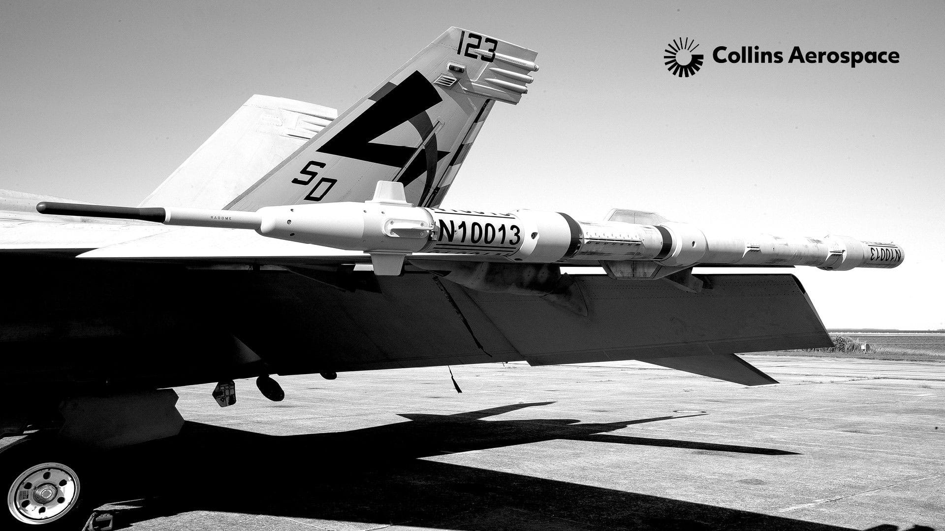 The back half of a fighter jet focusing on a wingtip-mounted missile