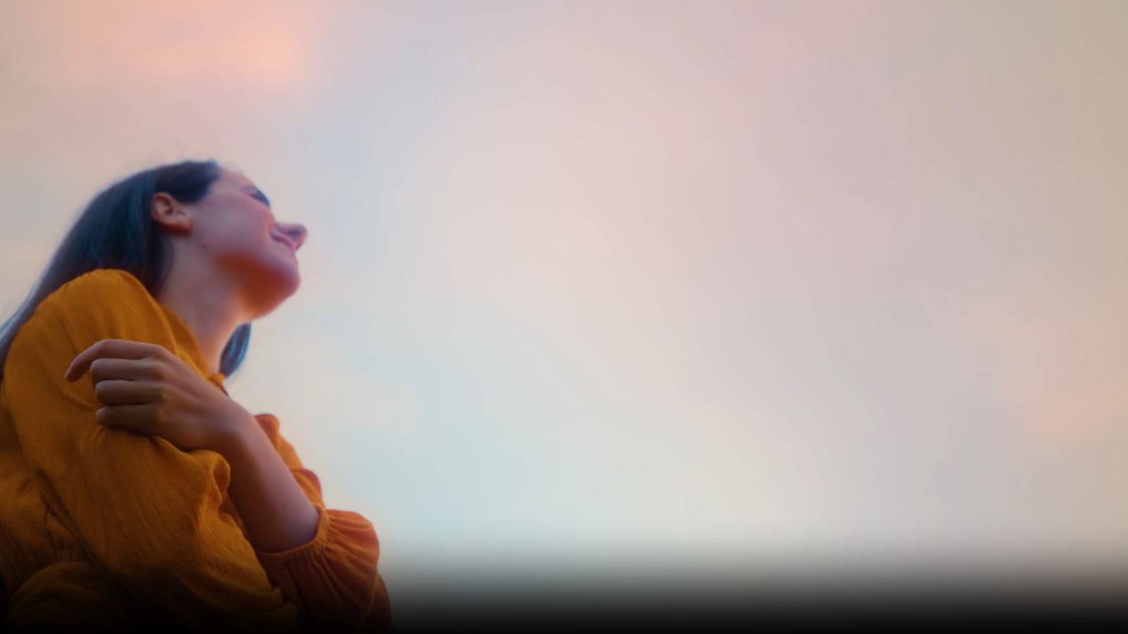 A woman looking up at the sky