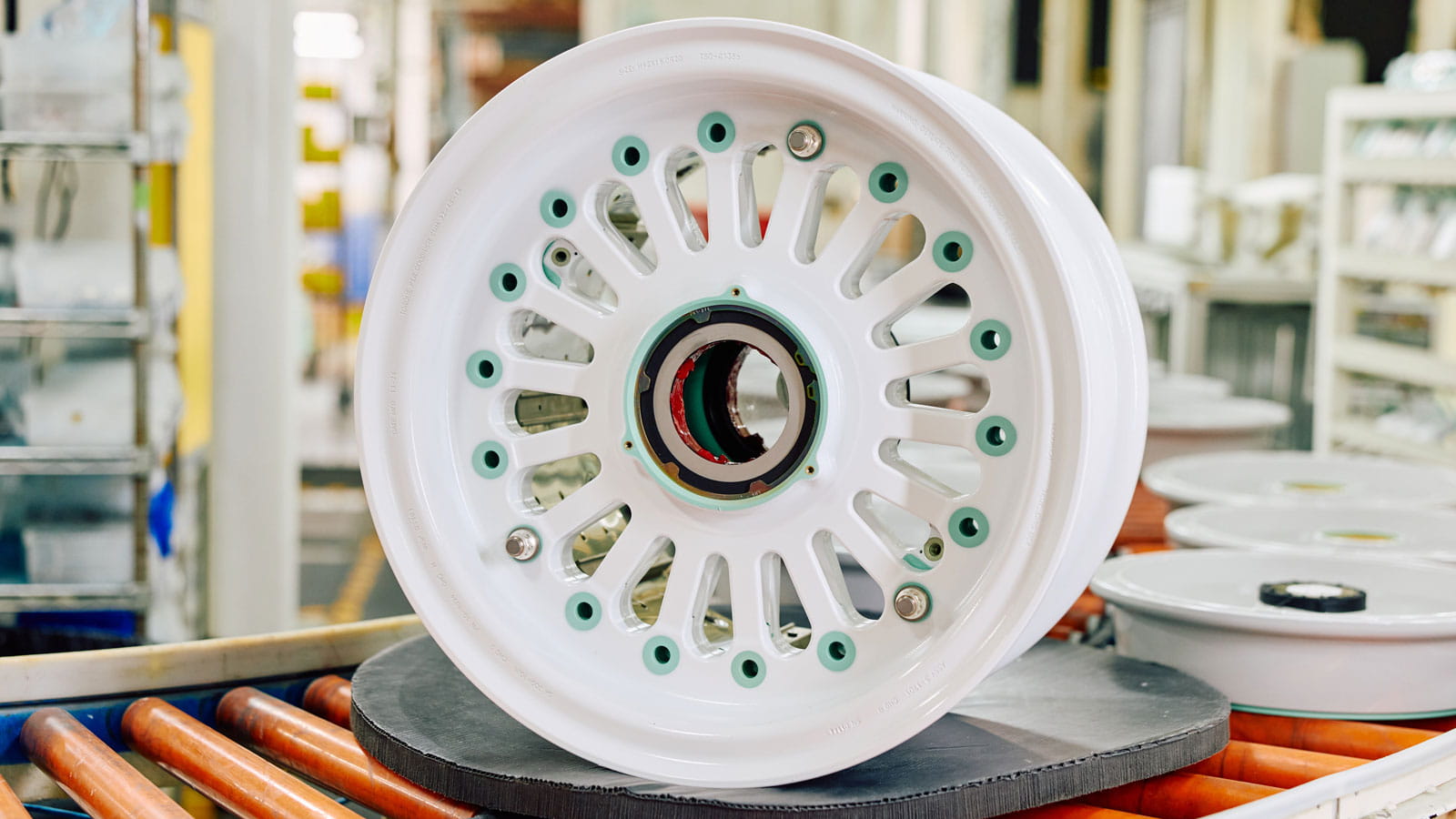 Wheel assembly includes joining both halves, adding components, inspecting and preparing for shipping.