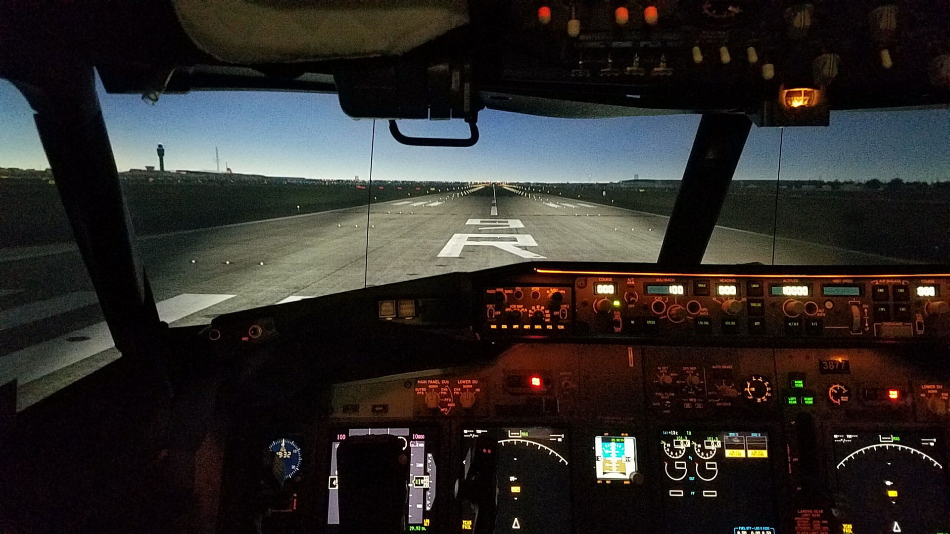 A simulated view of a runway out the flight deck window