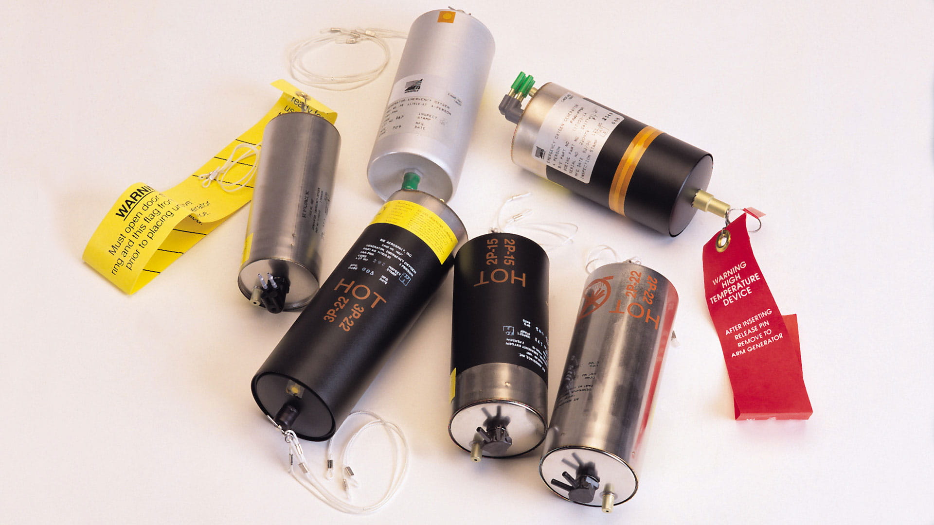 Six canisters and tags