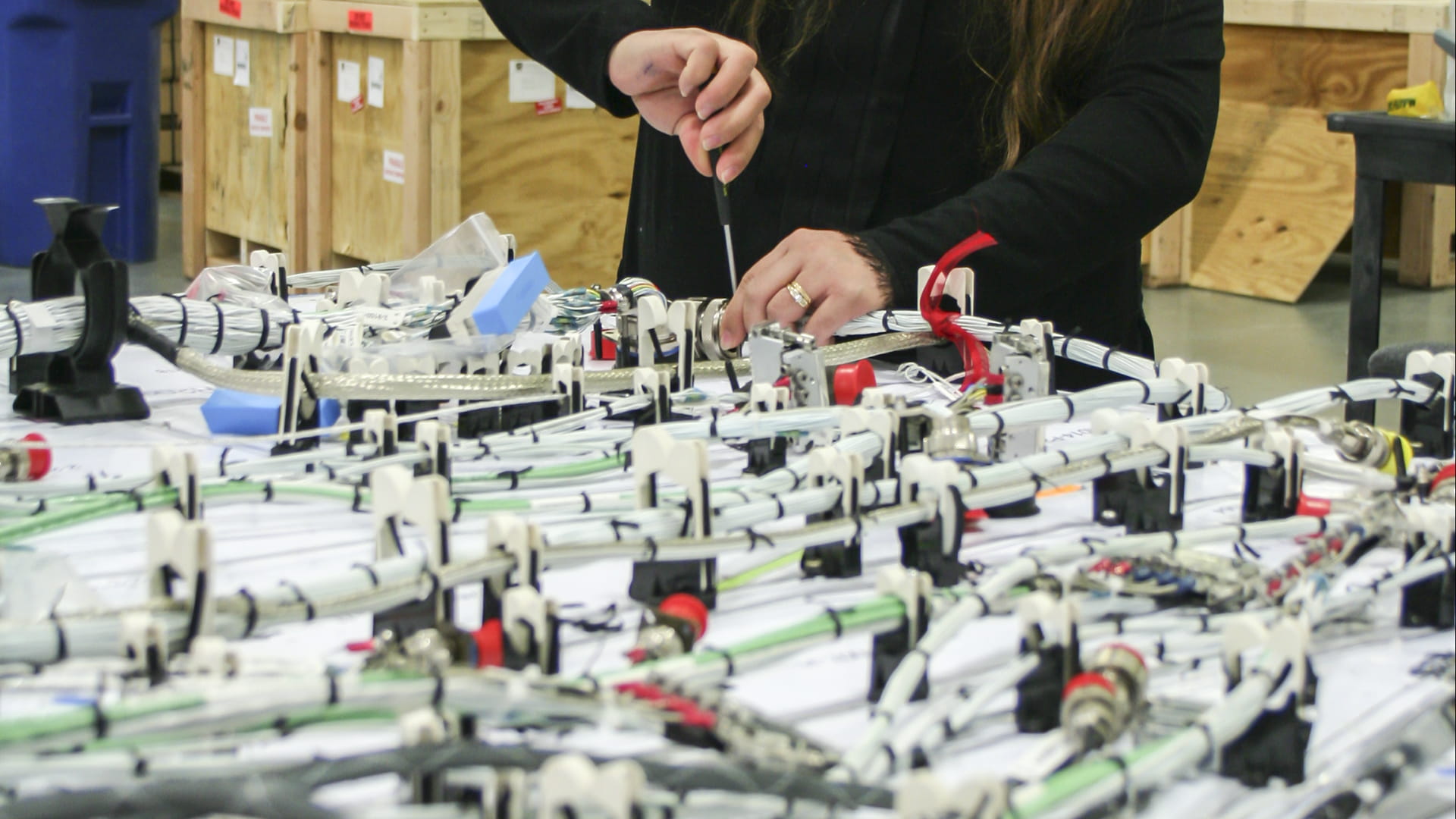 A woman works on an installation kit
