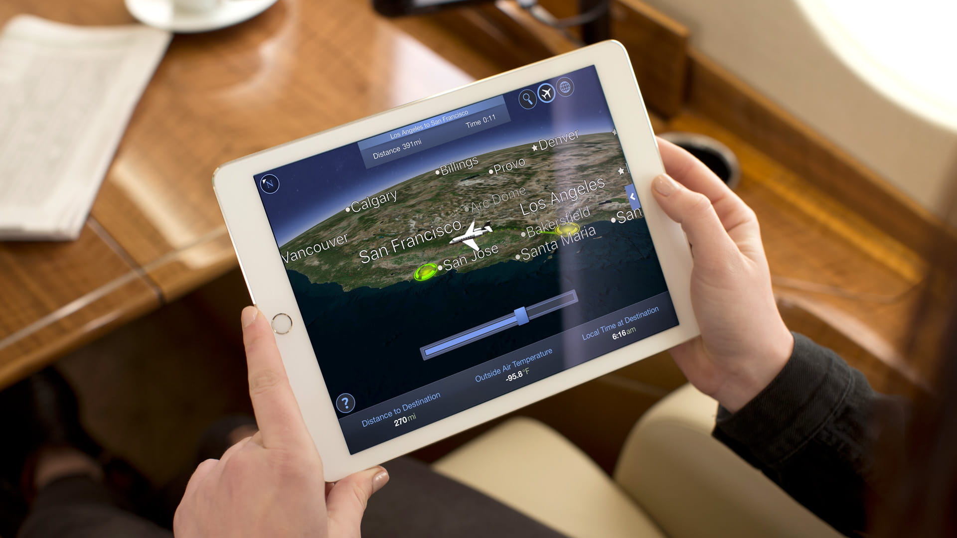 Man viewing iPad on flight