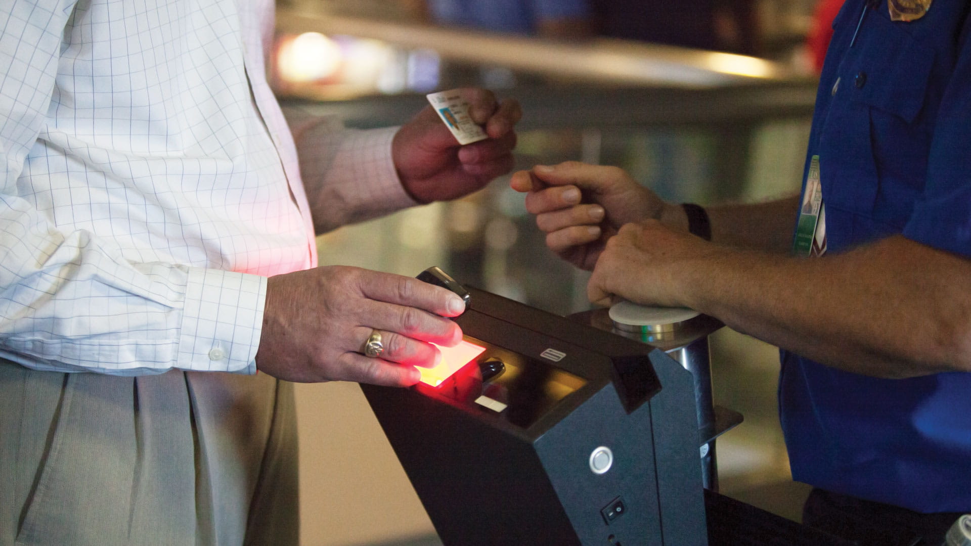 People interacting at an airport security check