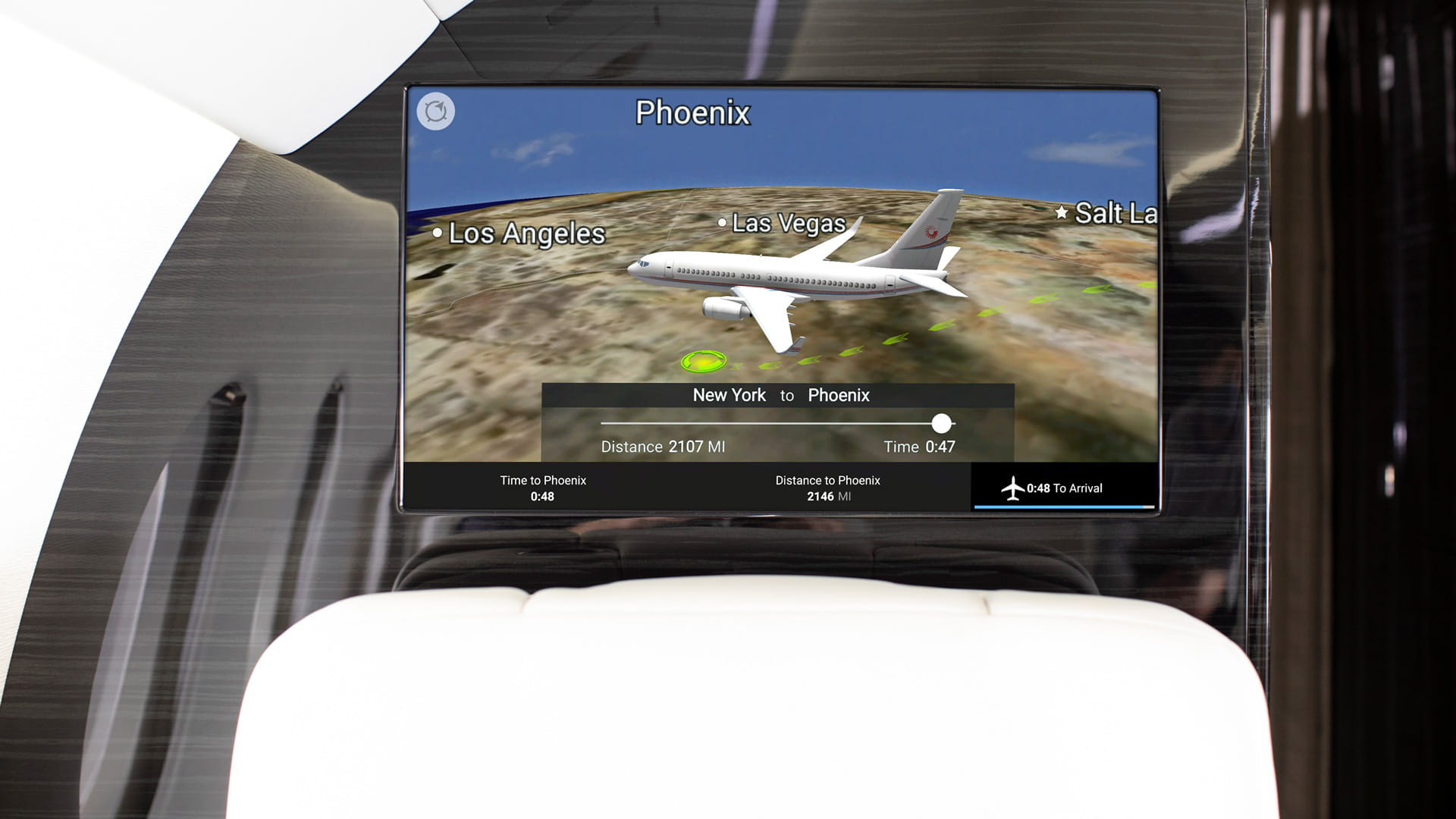 Bulkhead-mounted Airshow system. The screen shows a computer-generated image of an airplane flying over the United States en route from New York to Phoenix.