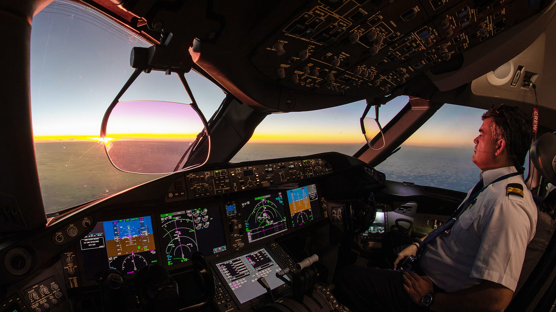 Airplane pilot in cockpit viewing horizon