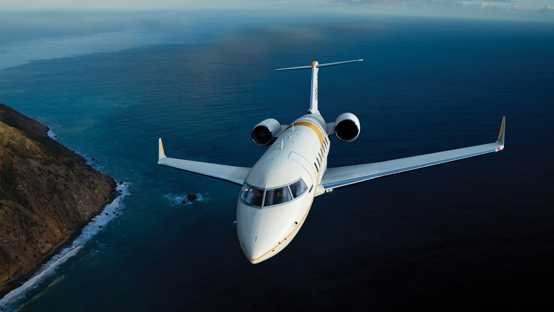 Challenger 605-650 jet over ocean