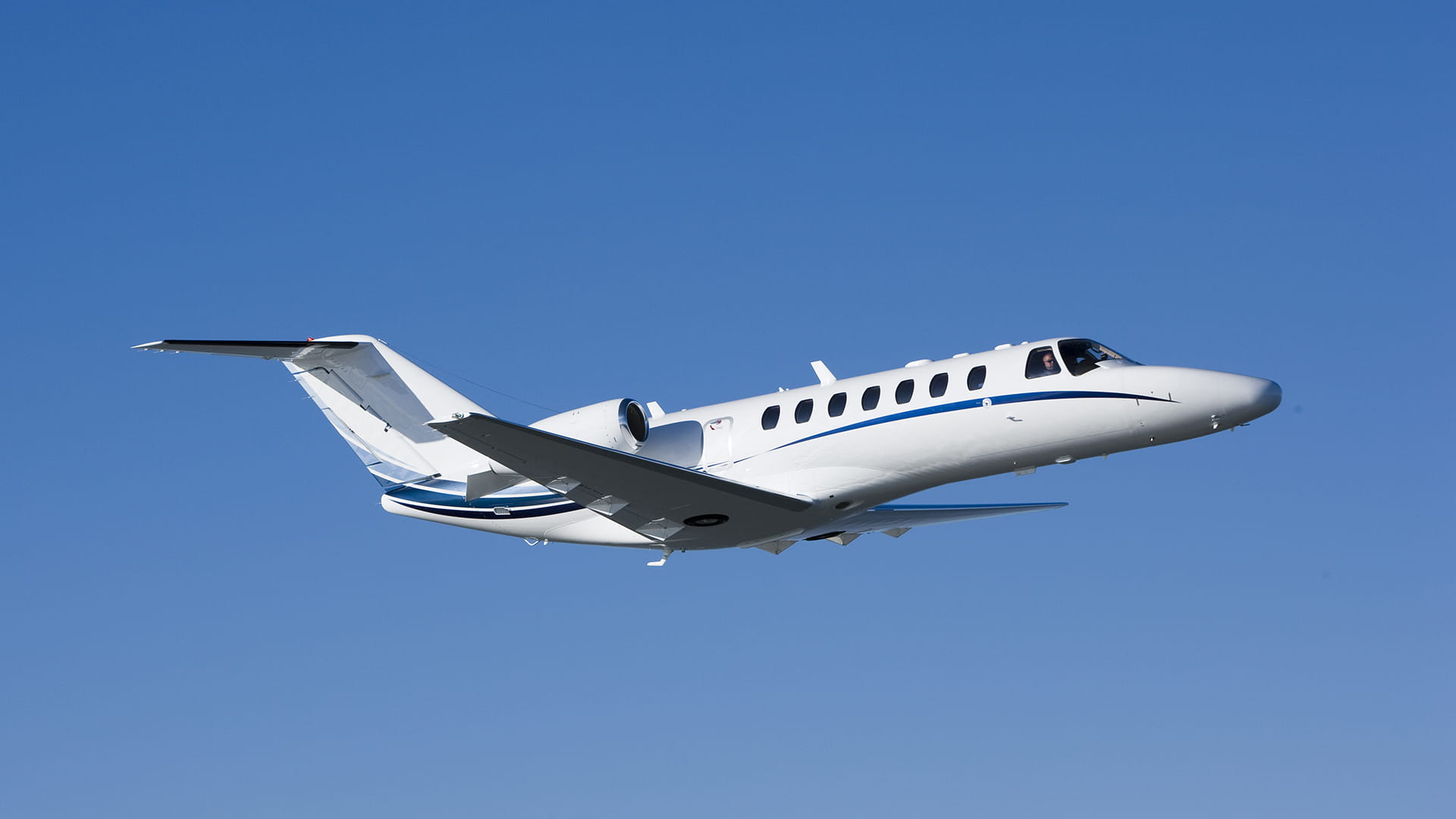 Cessna plane flying in the blue sky