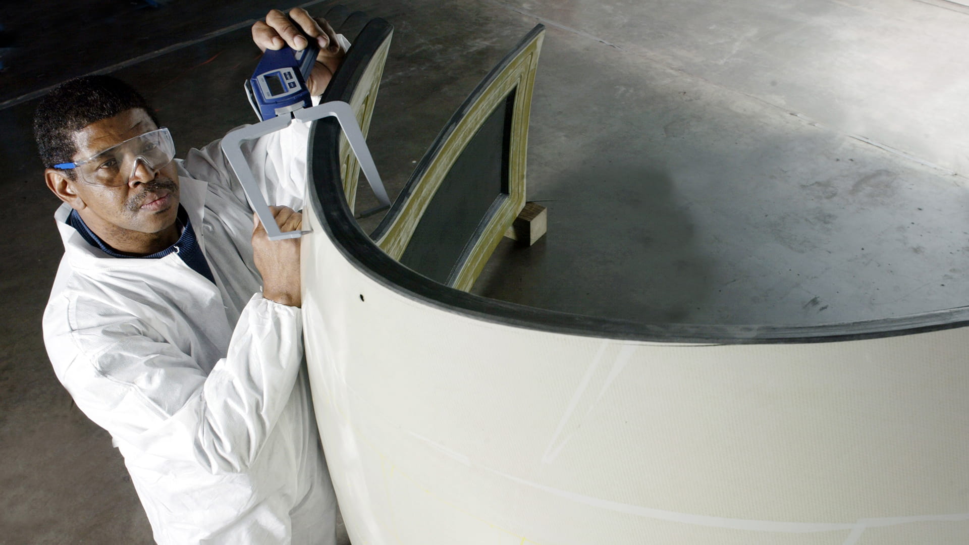 Engineer analyzing aerospace parts