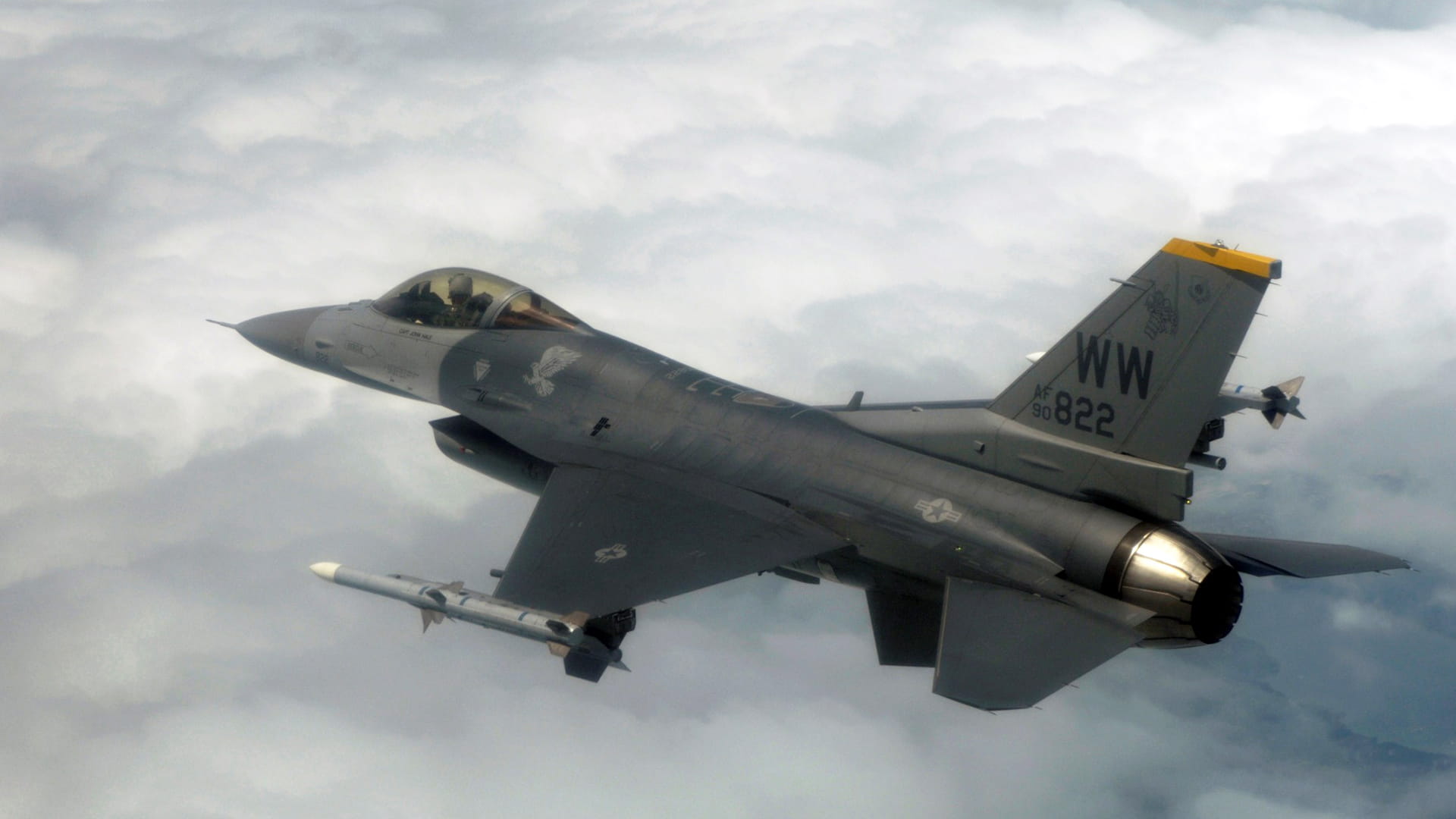 F-16 fighter jet above the clouds