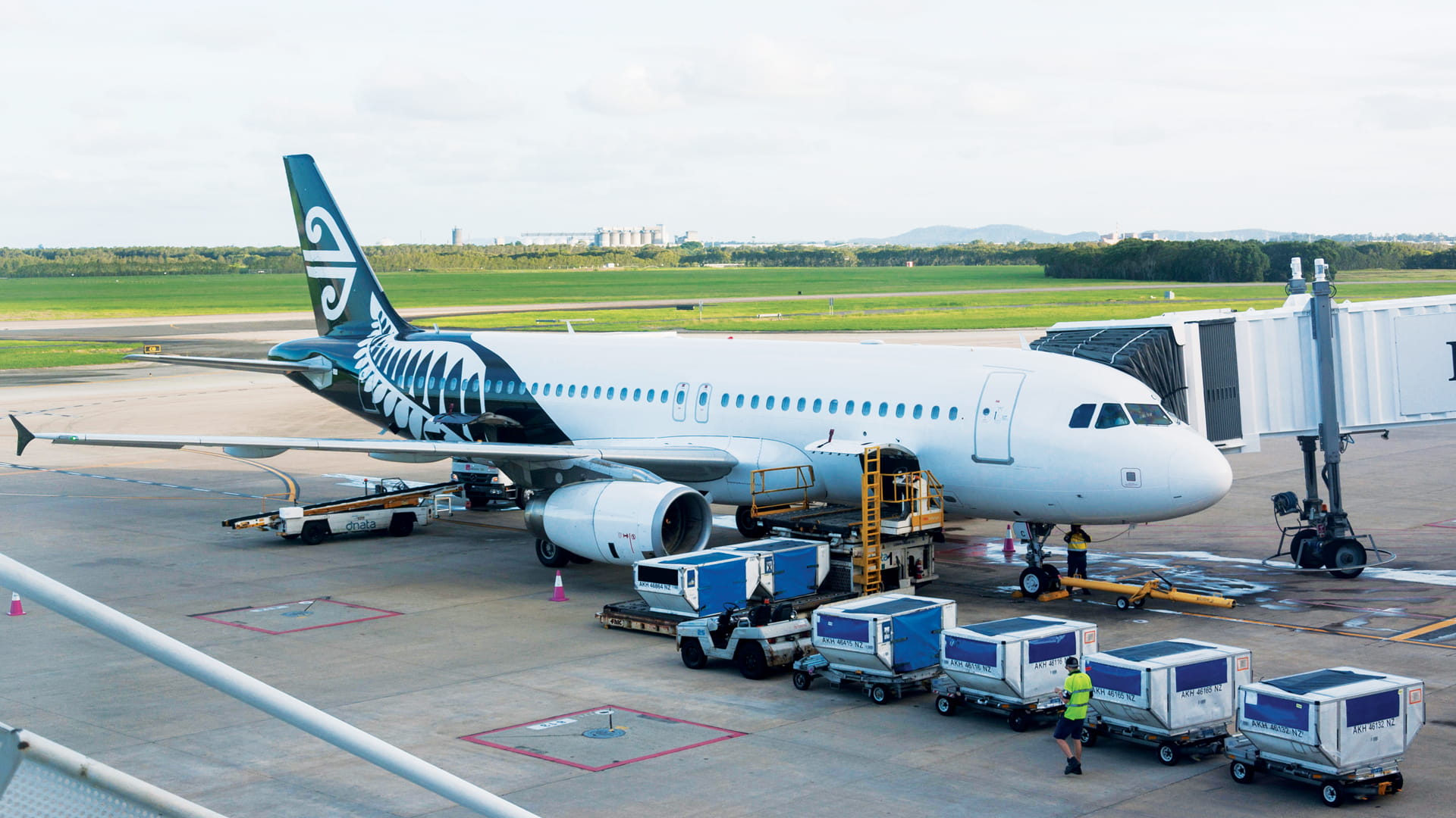 Airplane parked at jet bridge