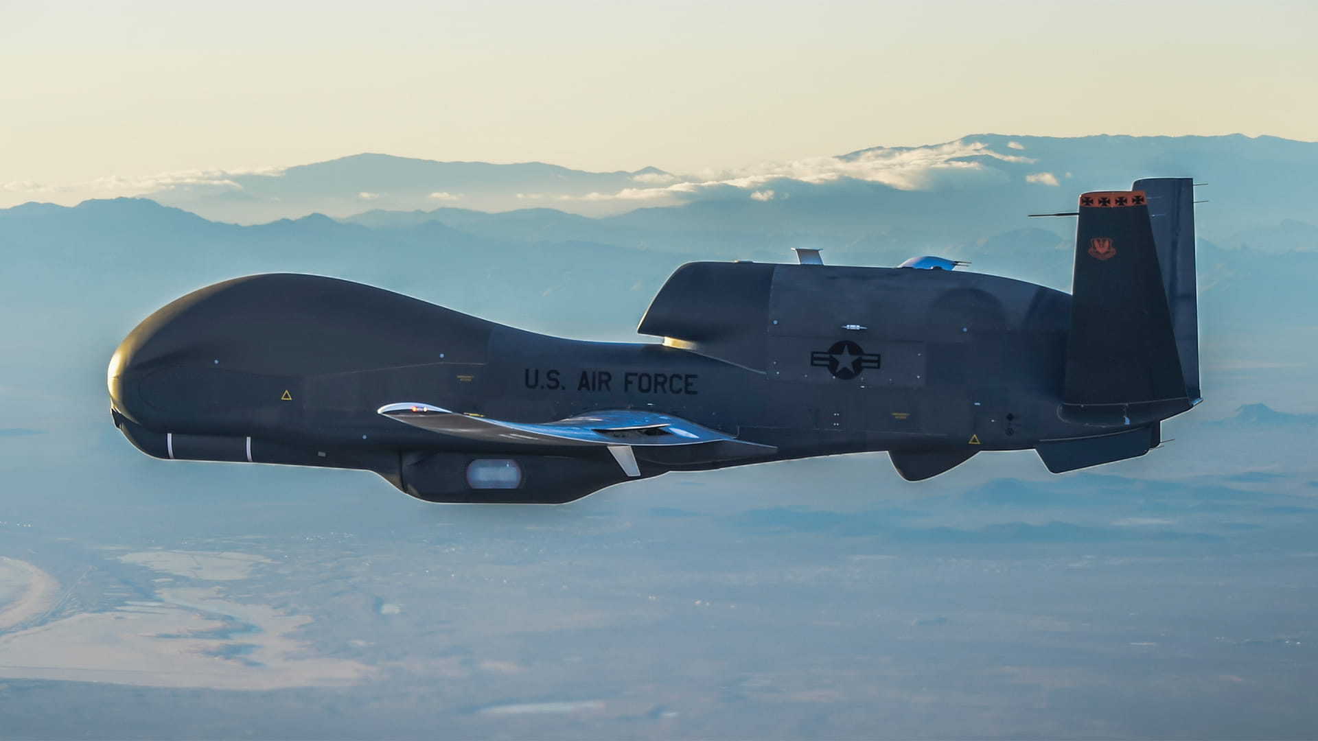 U.S. Air Force aircraft in flight equipped with Collins Aerospace de-icing systems to prevent ice buildup on wings and critical surfaces