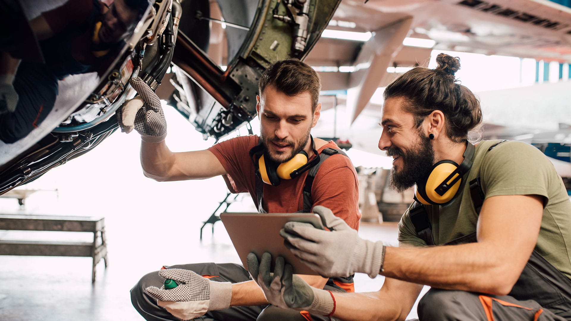 Aircraft personnel inspecting