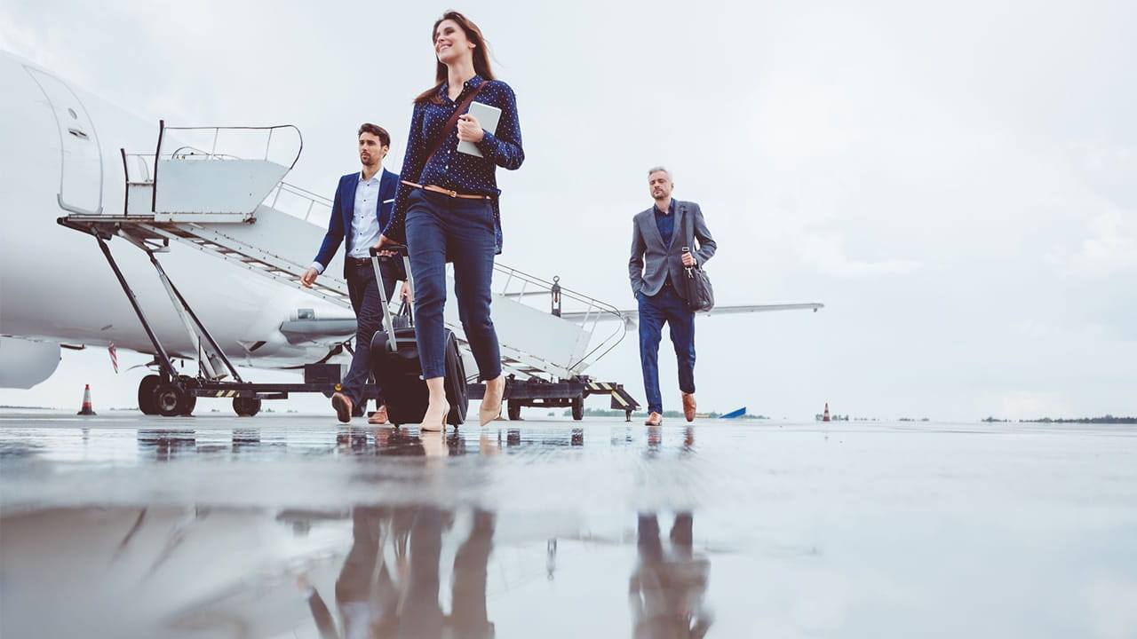 People walking from plane that just landed