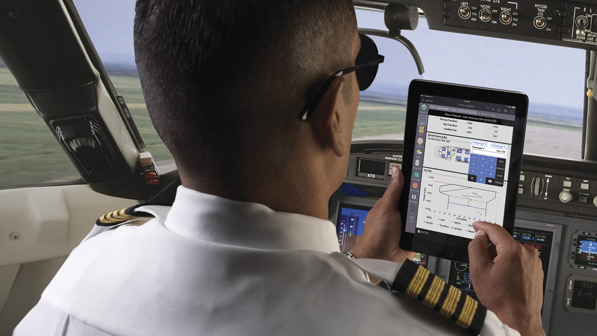 A pilot holding an ipad
