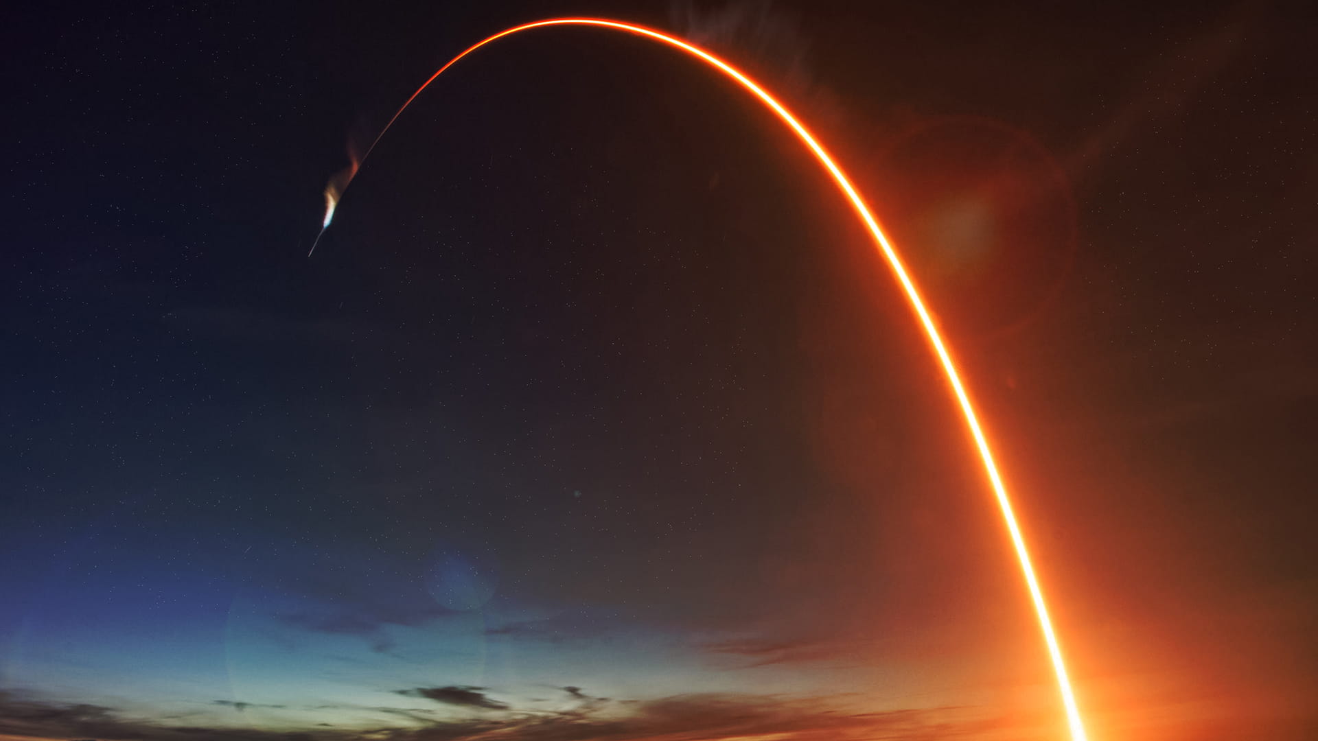 Missile launch at night. The elements of this image furnished by NASA