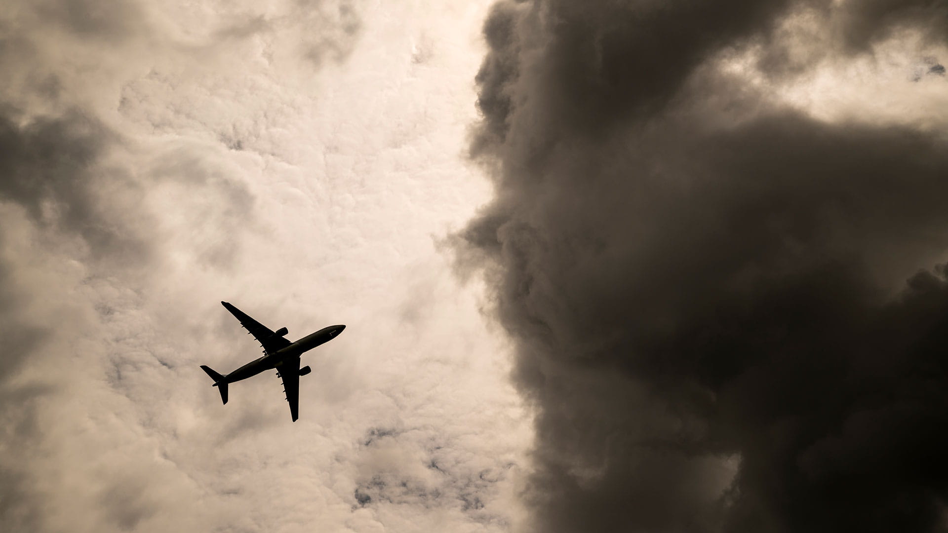 airplane flying through clouds