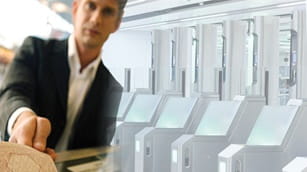 man giving passport to airport security agent