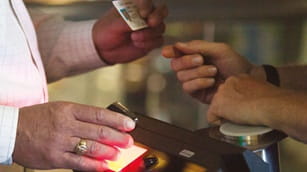 People interacting at an airport security check