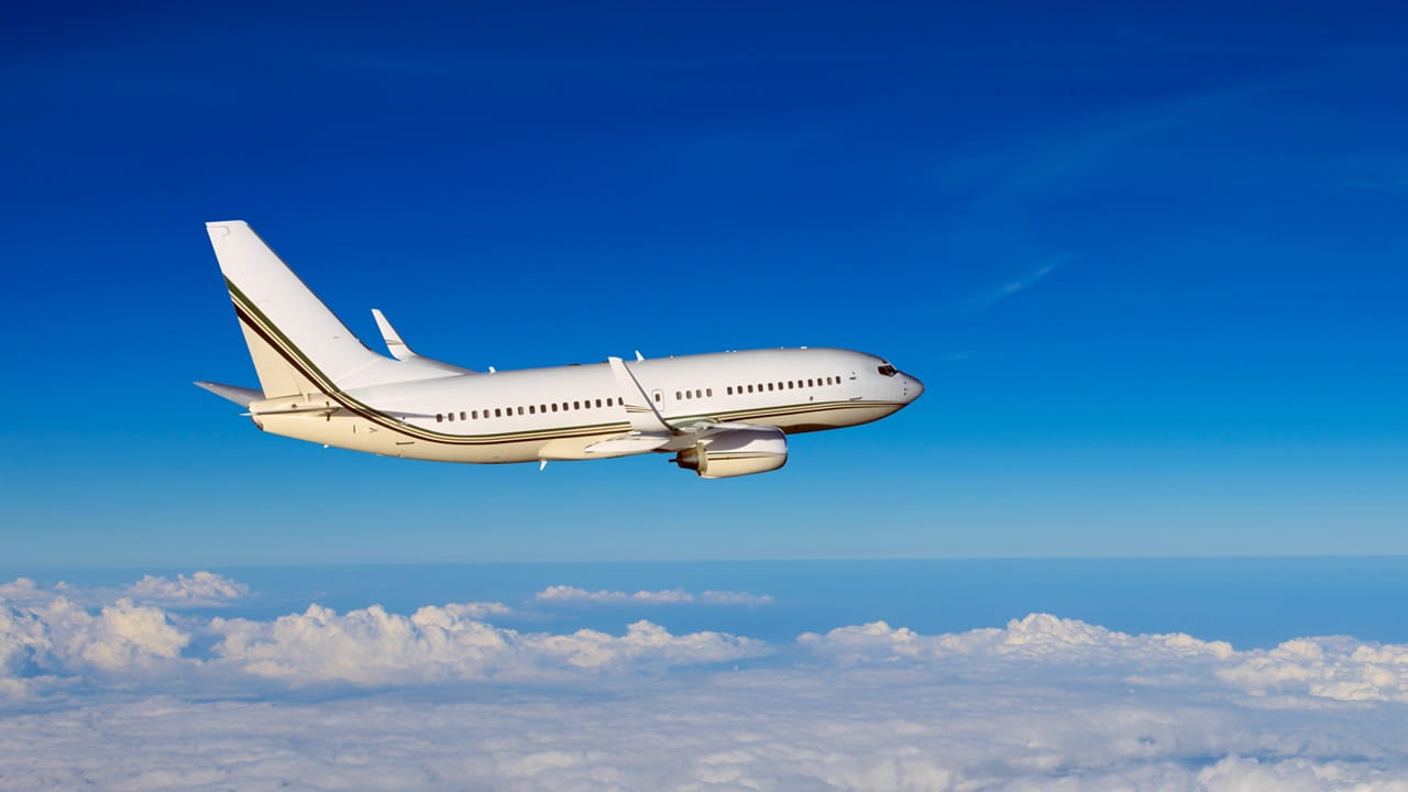 airplane flying above the clouds