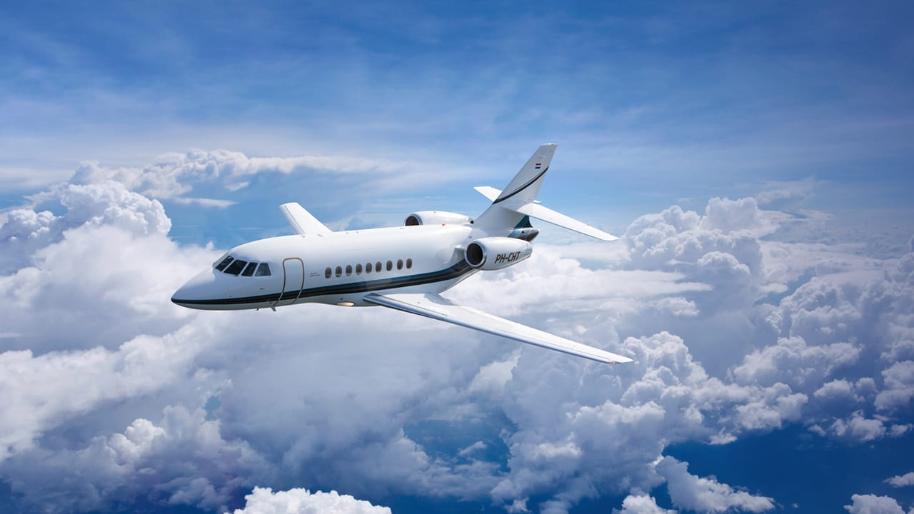 private jet flying through clouds