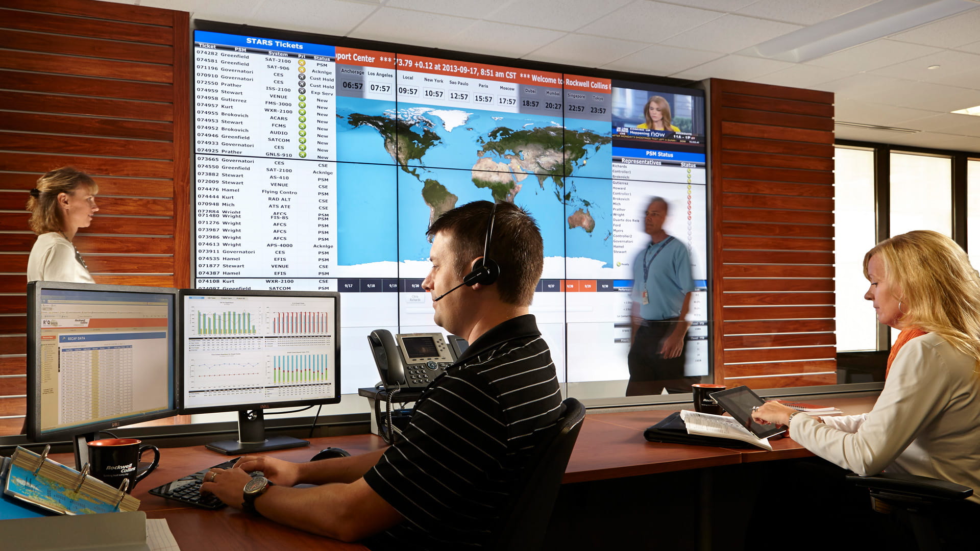 a man and woman working in a conference room