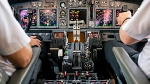 two pilots in airplane cockpit