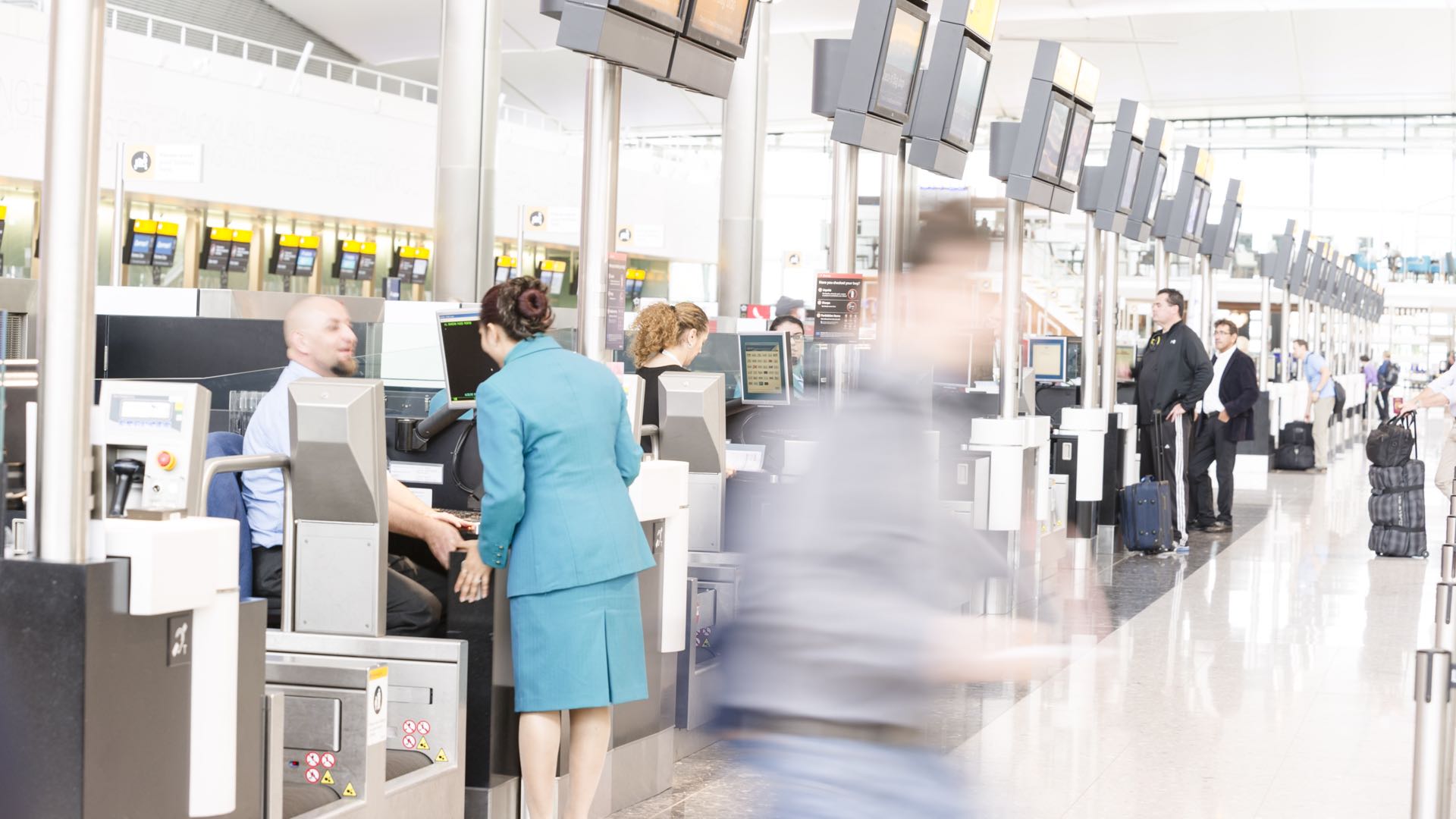 people in line at the airport ticket counter