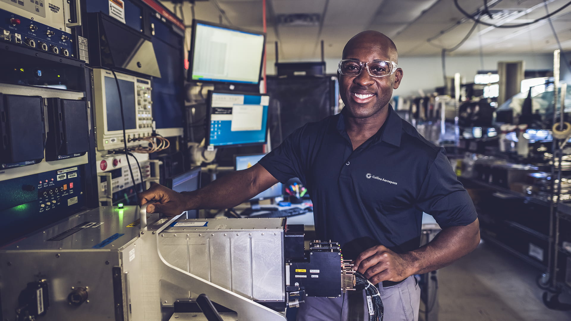 A man wearing a Collins Aerospace polo at work inside the Wichita Service Center