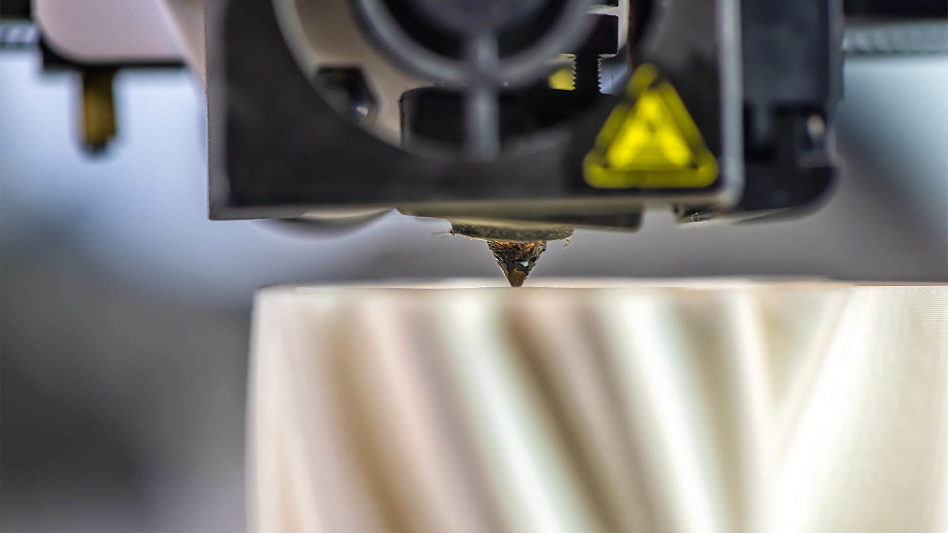 The 3D printer prints the model out of white plastic. modern technology.