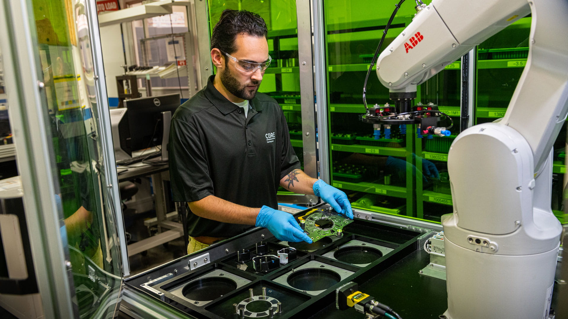 A man placing a circuit board