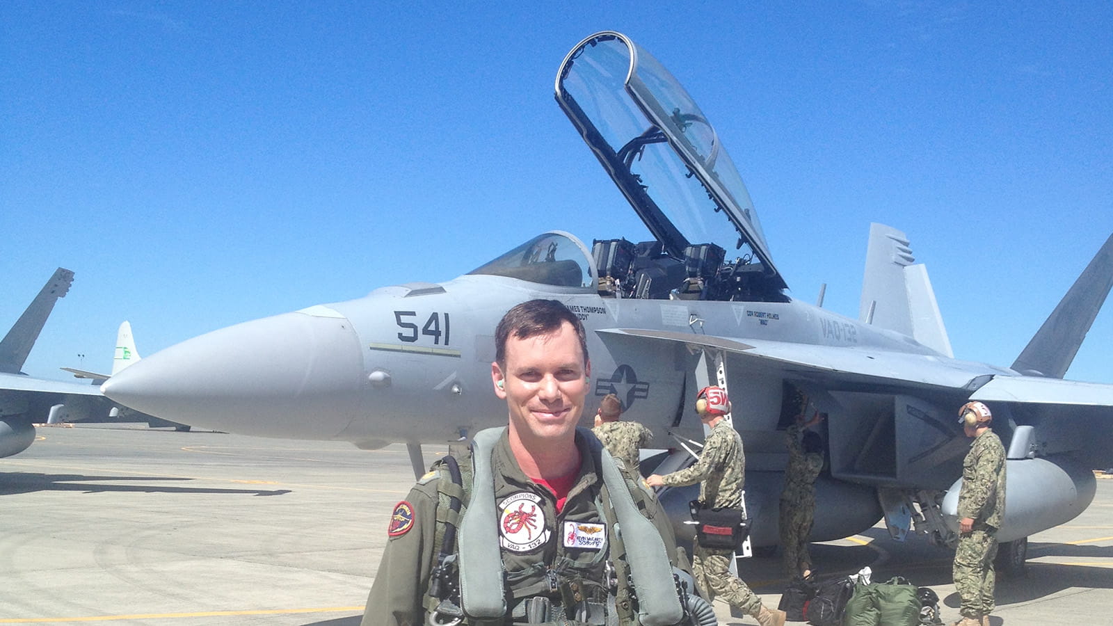 Kevin McCarty in front of an F-18