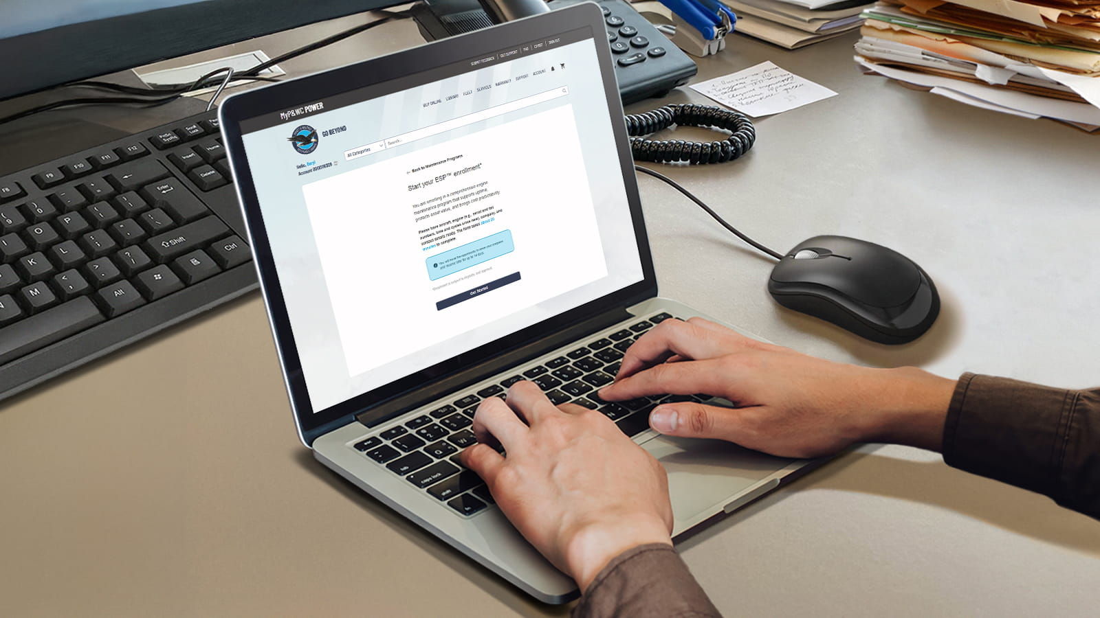 open laptop with perosn's hands typing