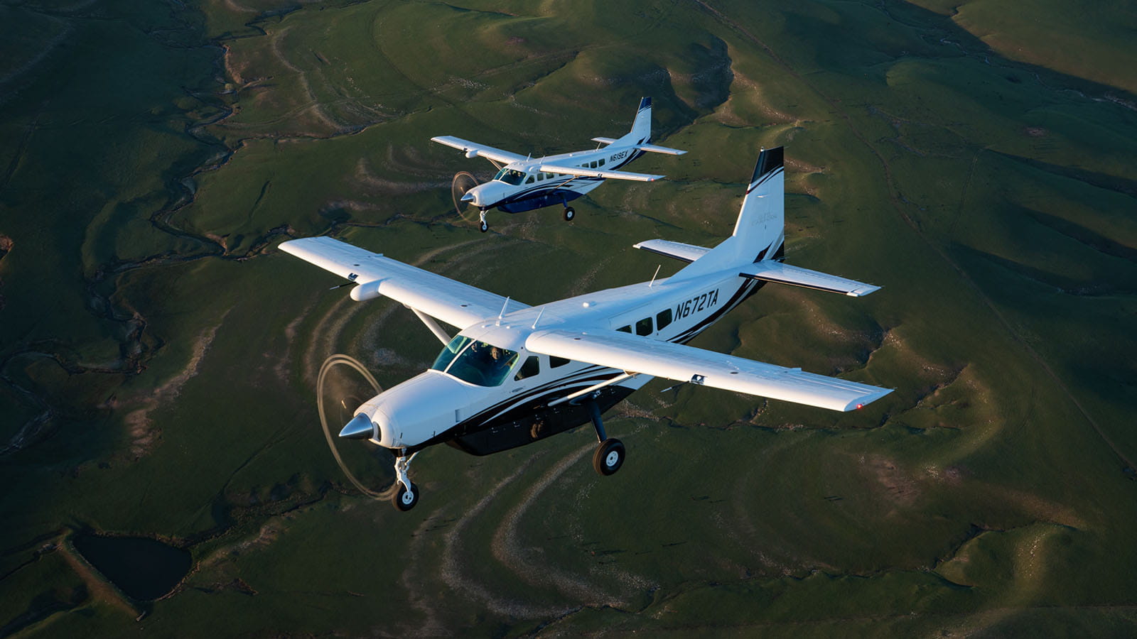 two cessna caravans in flight