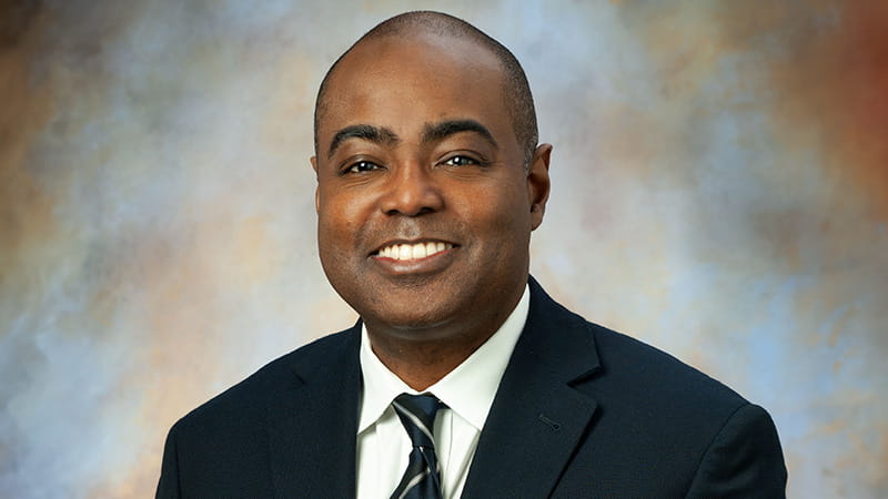 Bradshaw profile on digital mottled background