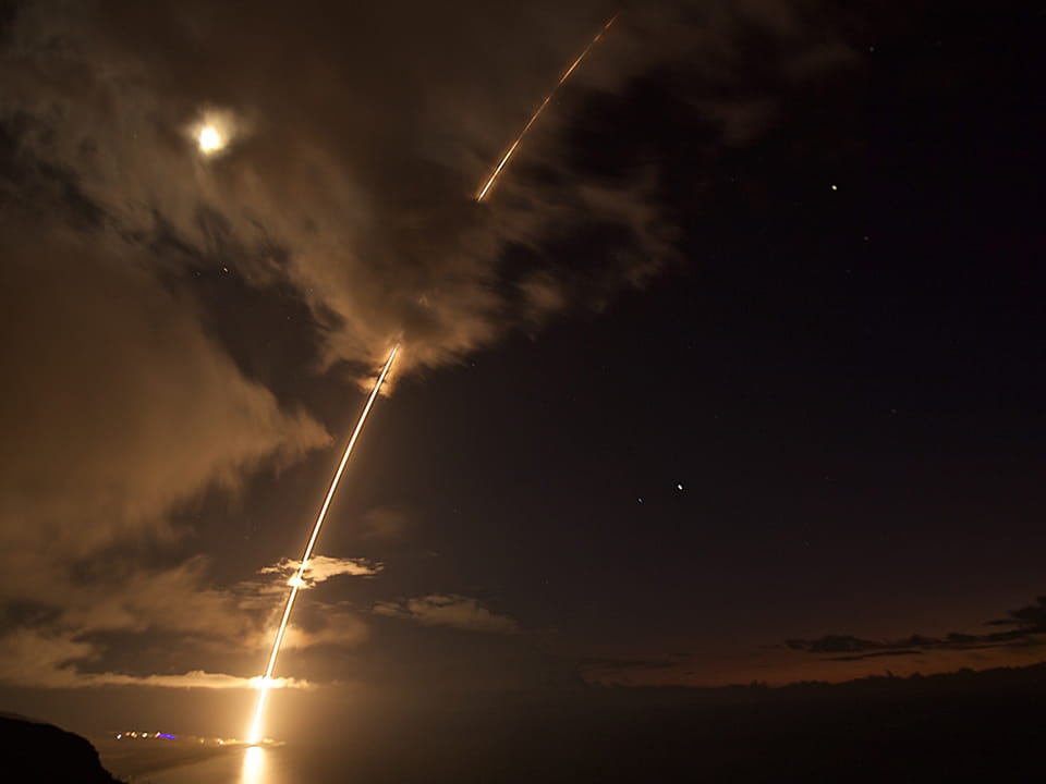 An SM-6® missile fired from the guided missile destroyer USS John Paul Jones intercepts a medium-range ballistic missile target during a live fire test at the Pacific Missile Range Facility in Kauai, Hawaii. (Photo: Missile Defense Agency)