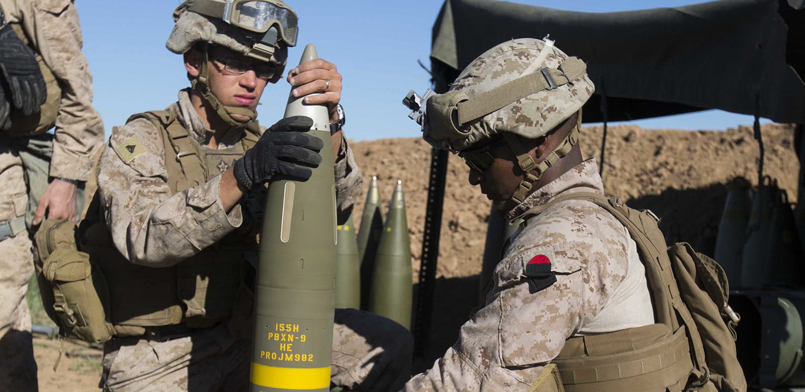 The U.S. Marine Corps prepare an Excalibur® 155 mm projectile round on Fire Base Bell, Iraq, while conducting fire missions. (Photo: U.S. Marine Corps)