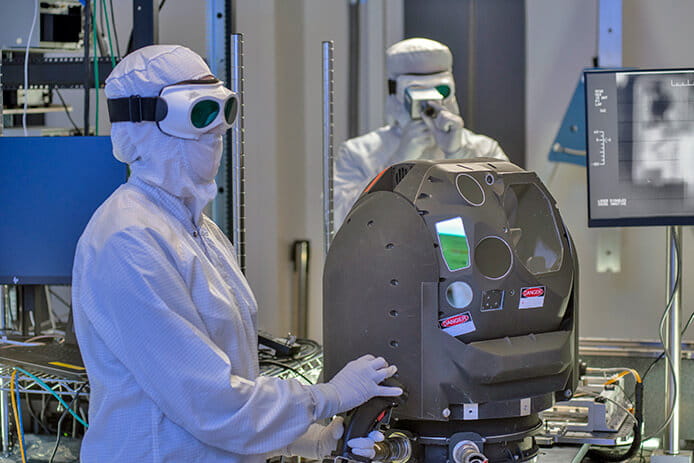 Two work on testing laser turret