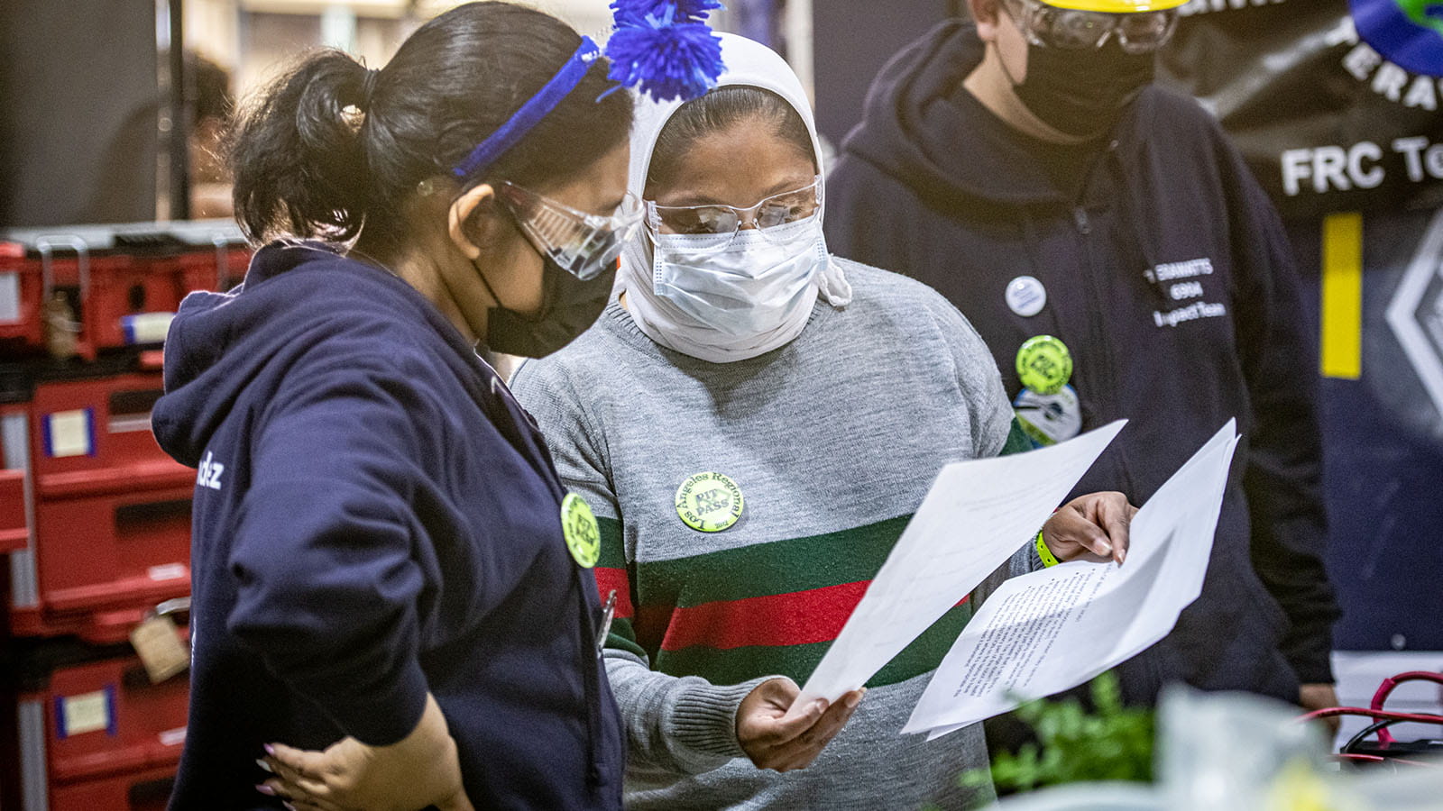 Fatima Iqbal-Zubair reviews the Terawatt’s documentation while preparing team member Sujeiry for their Chairman’s interview.