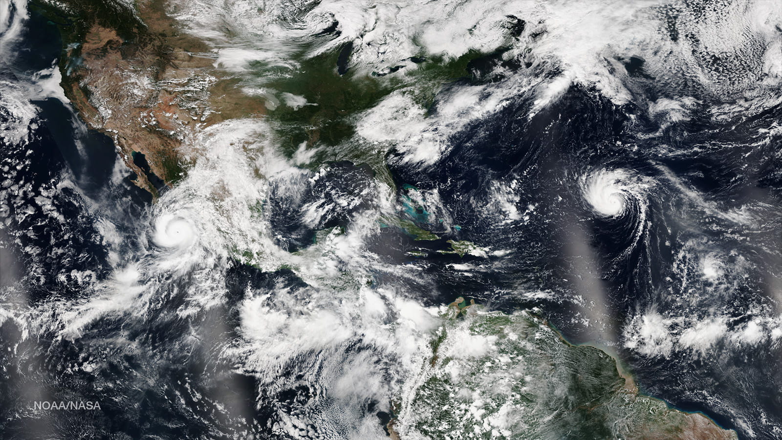 VIIRS captures Hurricane Odile in the Pacific Ocean and Hurricane Edouard in the Atlantic