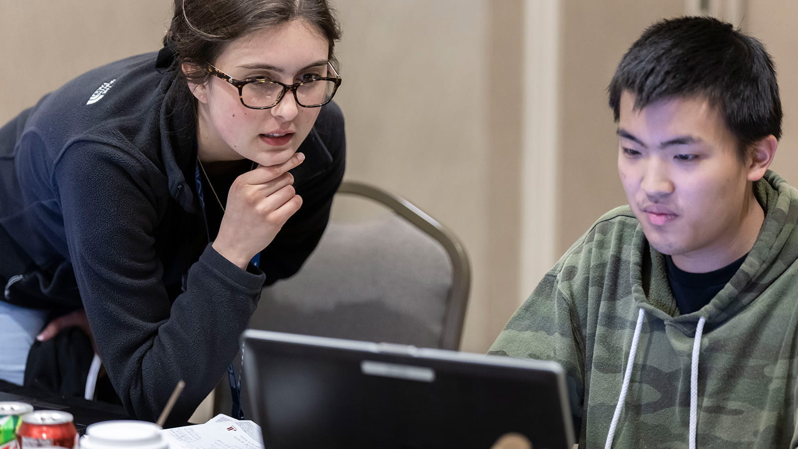 student instructing team member