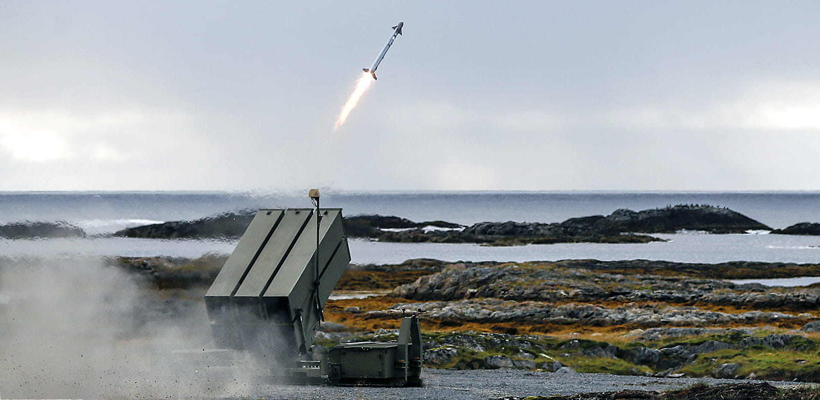 An AIM-9X SIDEWINDER missile is fired from a NASAMS air defense system during the SDPE demonstration in Andoya, Norway.