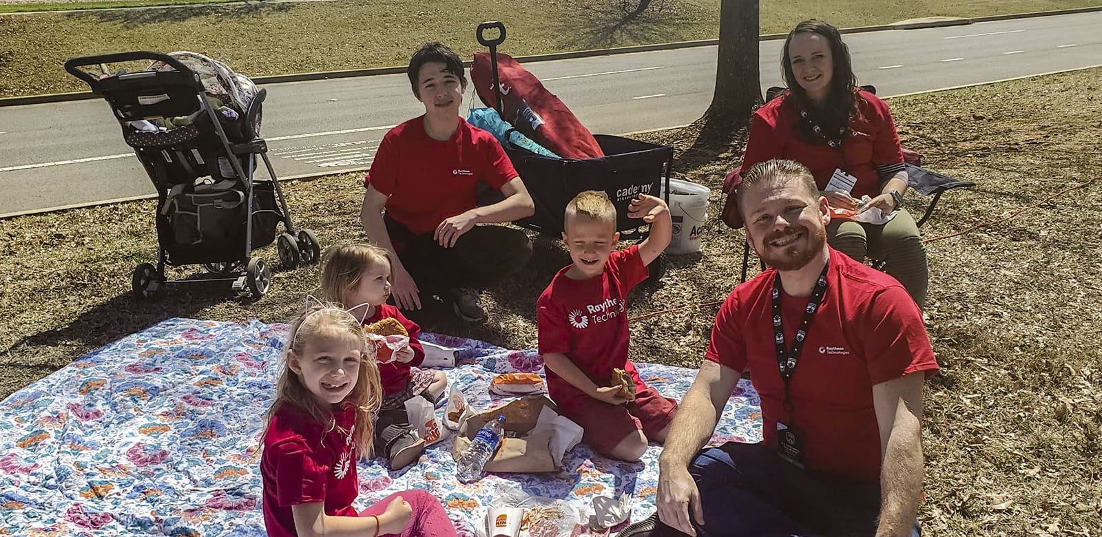 A Raytheon employee and his family attends the Paralympics Cycling Open as spectators.